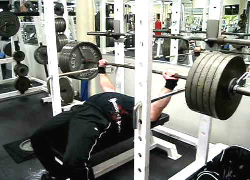 High pin press being performed on the bench press