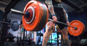 Powerlifting gear and equipment being used during deadlifts by an elite strength athlete