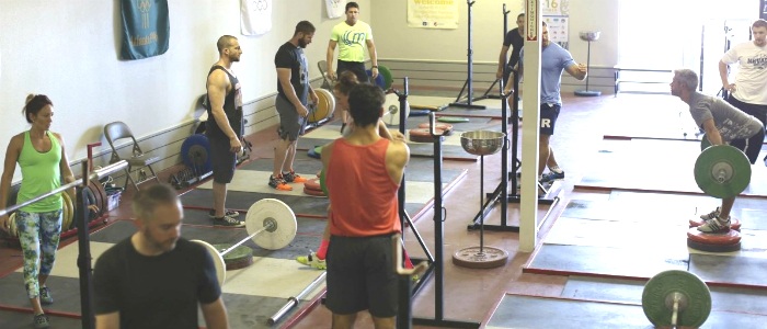 Group training session for Olympic weightlifting at Average Broz Gym