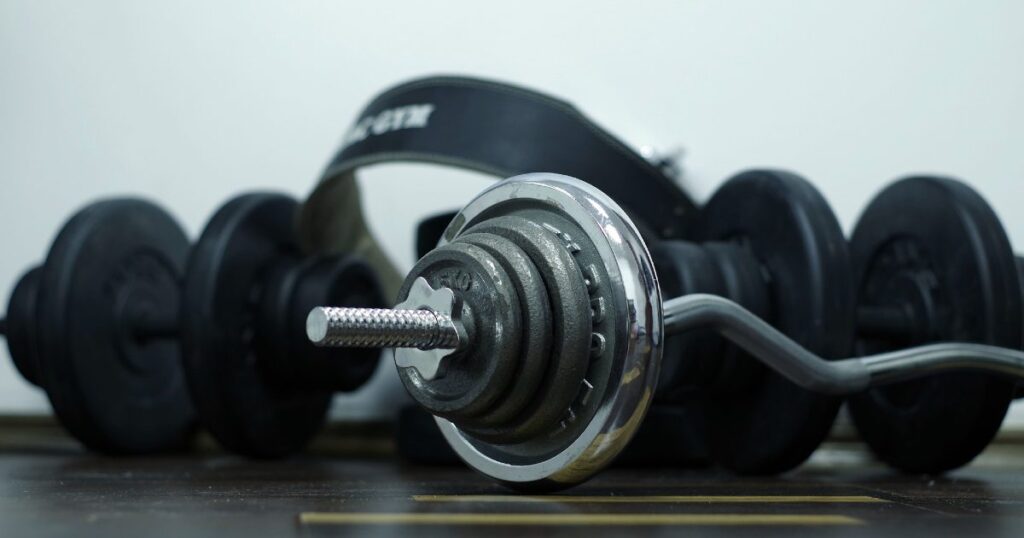A dumbbell and lifting straps to symbolize that exercise could be a solution to weight loss on herbalife. 
