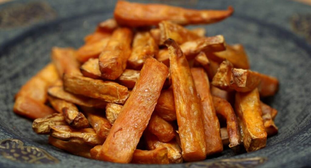 A medium serving of sweet potato French fries that were freshly salted. 