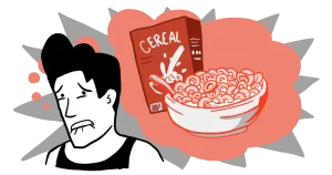 A man is looking at a bowl of honey nut cheerio cereal while fighting the cravings to eat the entire box.