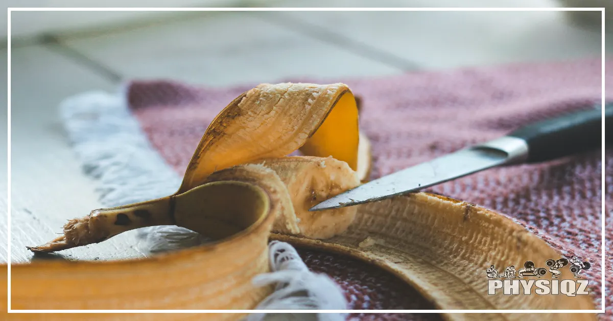 A banana sliced into small portions that are used as snacks and a kitchen knife sitting next to it after someone begged the question, "If you starve yourself, how long to lose weight?"