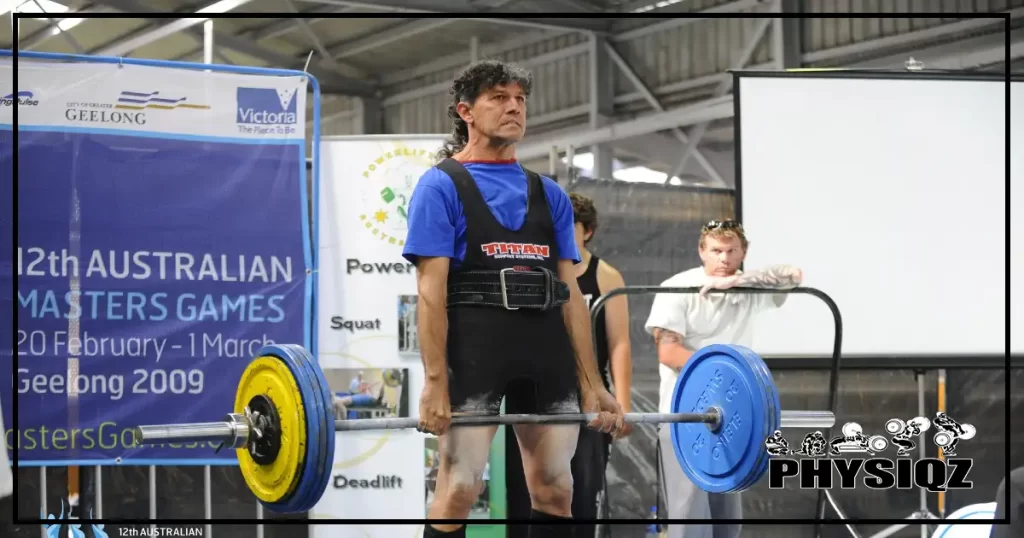 A man at a powerlifting competition performing stop and go or reset deadlifts since they're best for strength athletes. 