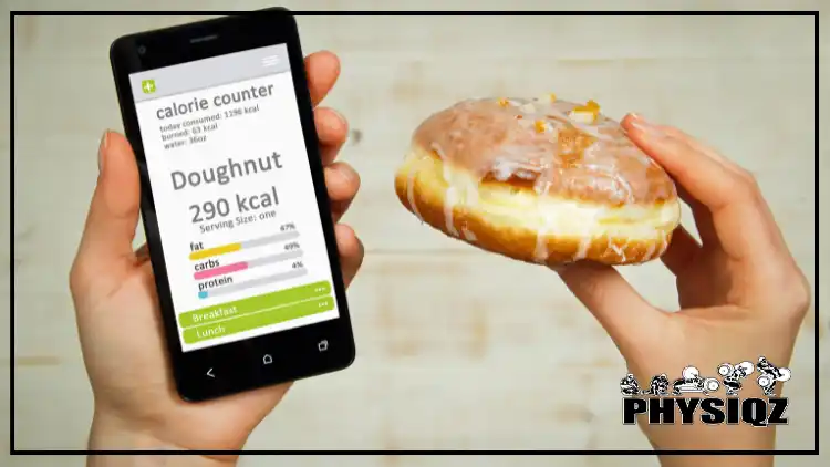 A cell phone with a counting calorie app in a persons left hand showing how many calories are on a donut while their right hand is holding a cream filled glazed donut. 