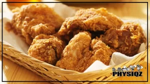 A basket filled with a bunch of Bojangles keto fried chicken and served on a wooden table.