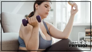 A woman in a gray tank top and pants is holding a dumbbell in one hand and a donut in the other, looking frustrated as wondering "Can I eat a donut and still lose weight?"