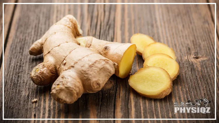 A piece of ginger root is lying on a piece of wood and a section of it is cut into four thin slices. 