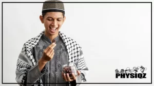 A young man is wearing a shemagh like drape over his shoulder and it's black and white in color as he holds a jar of dates in his right hand, and puts a piece of dates near his mouth with his left hand while wondering how many dates to eat per day for weight loss, and other reasons such as constipation, hair growth and overall health.