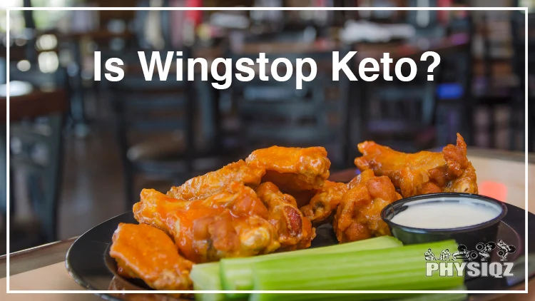A serving of chicken wings with celery sticks and a small bowl of ranch dressing on the side, a sample Wingstop keto order, beautifully served on a black plate in a restaurant table.