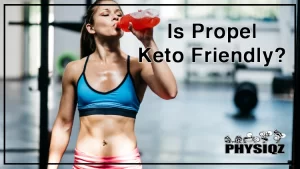 A woman wearing a black and blue sports bra and pink shorts is sweating after a workout drinks a bottle of flavor infused water while also thinking, "is Propel keto friendly".