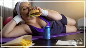 A white woman in a headband and wrist sweat bands is laying on a purple yoga mat inside her living room with a red ball in the background and she's taking a bite out of a burger while periodically eating and drinking the french fries and pepsi soda in front of her which makes her consider "What happens if you workout but don't eat healthy-ish?".