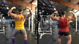 On the right is a guy in a red shirt with the sleeves cut off and doing a front double bi pose that shows he has good bicep genetics, and on the left is a guy in a yellow t-back tank top in grey shorts also doing a front double bi that shows he has bad bicep genetics in comparison to the guy next to him.