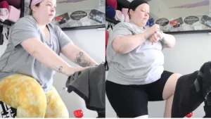 Emily's before and after photo shows her pedaling on her indoor stationary bike that's in a room of her house with a key hook hanging on the wall in the background and she asking herself "How often should i ride my Peloton to see results?".