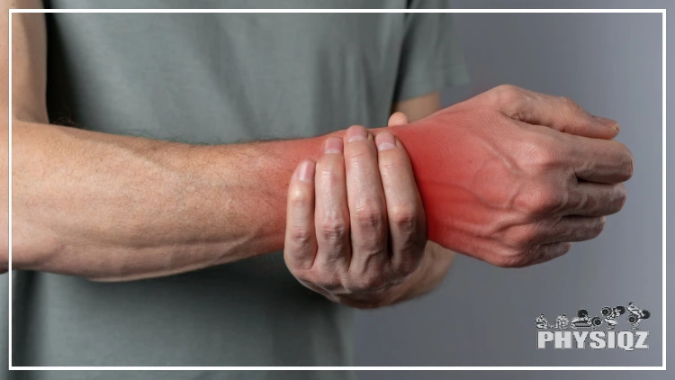 A person wearing grey shirt holding the right wrist in red indicating pain.