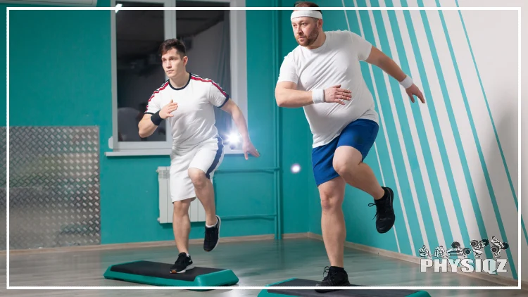 Two guys in white shirts have their right foot on a plyo box that's an aqua color.