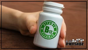 A white pill bottle that has "Vitamin B12" in green is being held by a white woman with long nails who asks her self "Can you take B12 while on keto diet," and she's resting it on top of a brown suede material.