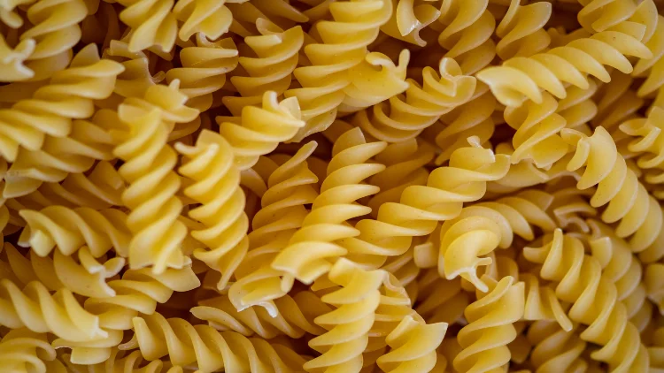 Close-up image of chickpea rotini pasta noodles.