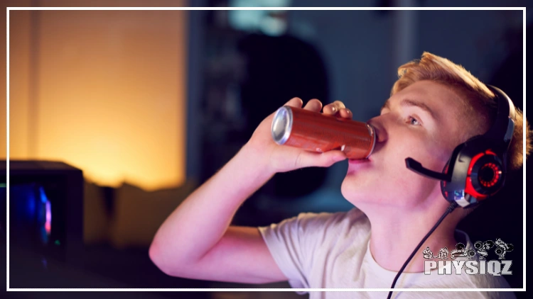 A teenage boy sitting in front of a computer with a gaming headset on his head, he is holding a red energy drink can and taking a sip from it, the boy looks focused on his screen, with a serious expression on his face, the energy drink can has a silver tab and a bold red label.