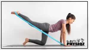 A woman wearing fitness clothes and using a resistance band to perform donkey kick floor exercises, focusing on glute muscle activation and kickback for cellulite reduction.