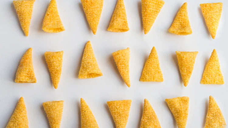 Bugles chips arranged in an alternating pattern on a plain white background.